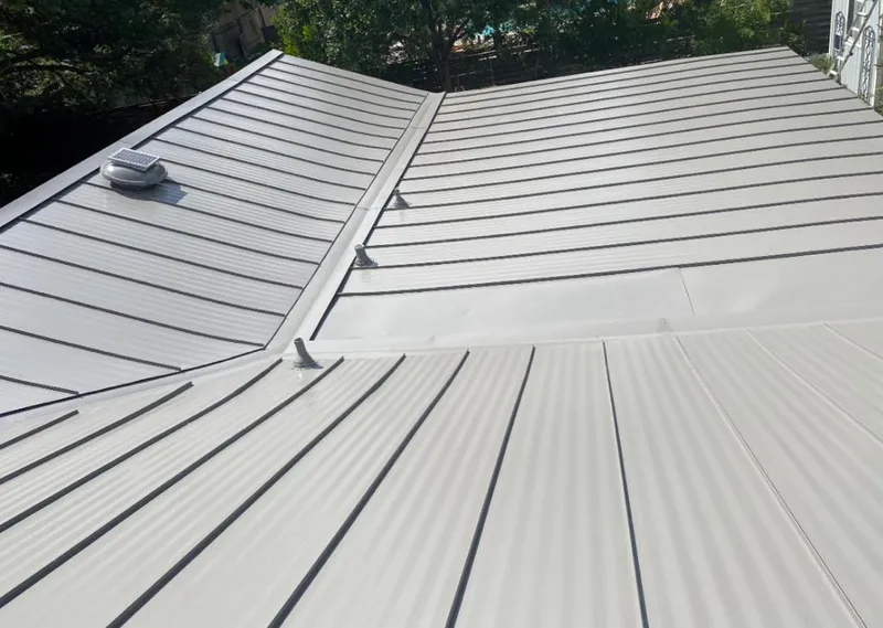 Solar attic fan installed on a metal roof for Roof Ventilation in Socastee